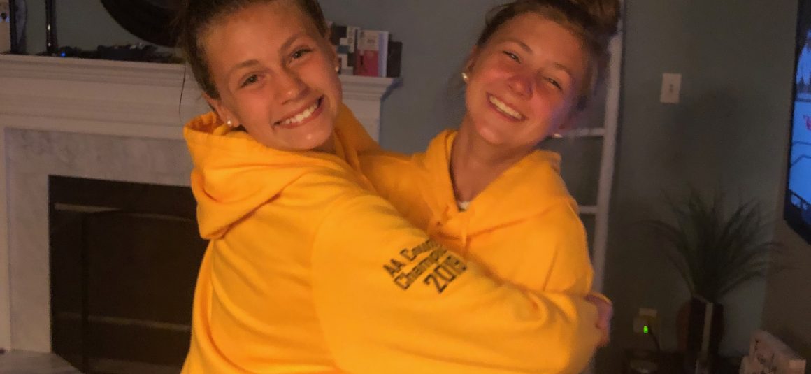 A Middie and her Goalie celebrating the latest in Championship Wear!